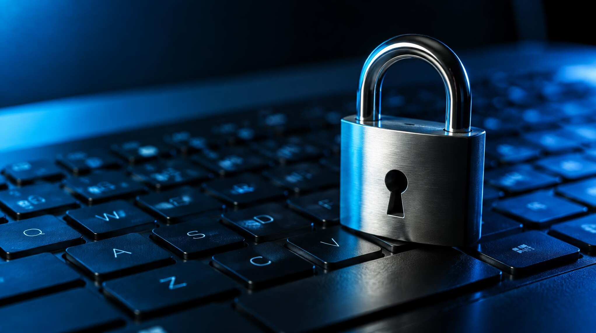 Metal padlock resting on a computer keyboard