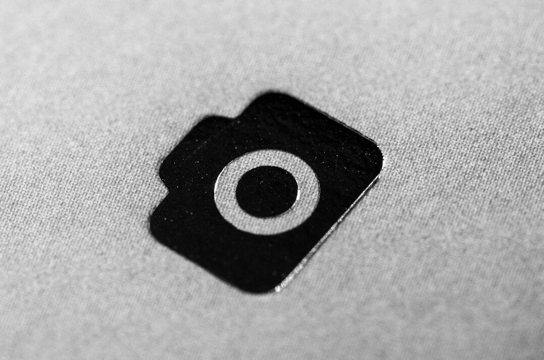 Laptop webcam covered with a small black sticker